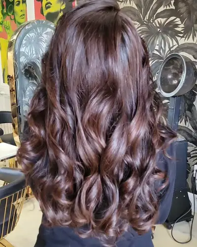 Rich chocolate brown colour styled in big curls