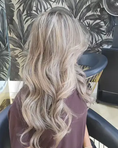 Ash blonde balayage in soft waves