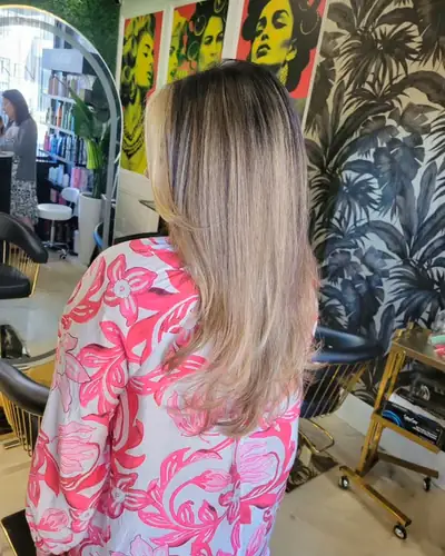 Straight blonde balayage over a dark root