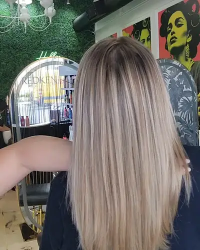 Long bright blonde hair with a sleek finish