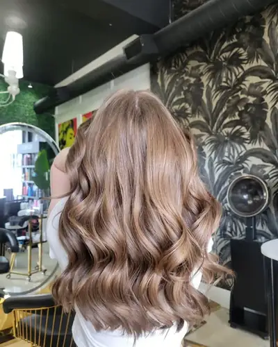 Golden brown balayage in loose curls