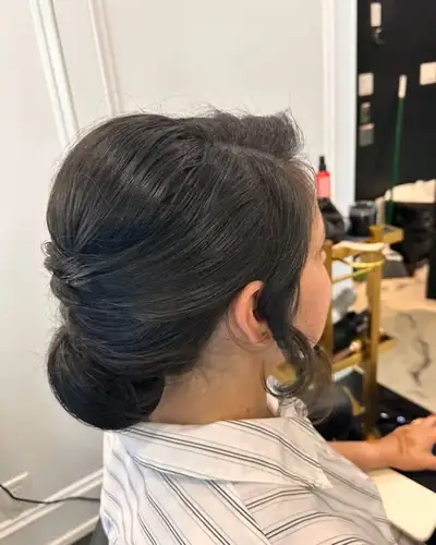 Smooth low chignon on dark hair