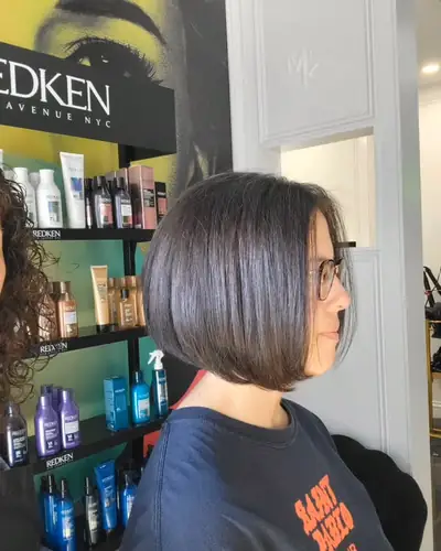 Sleek chin length bob on dark hair