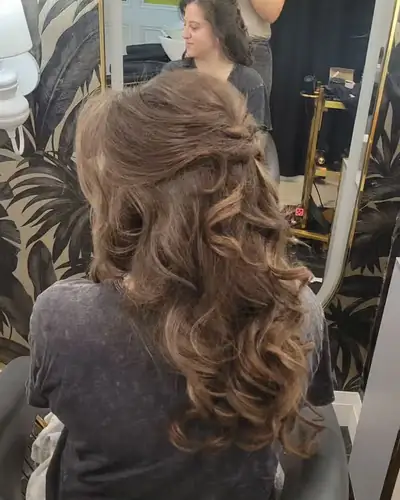 Romantic half up style with soft curls